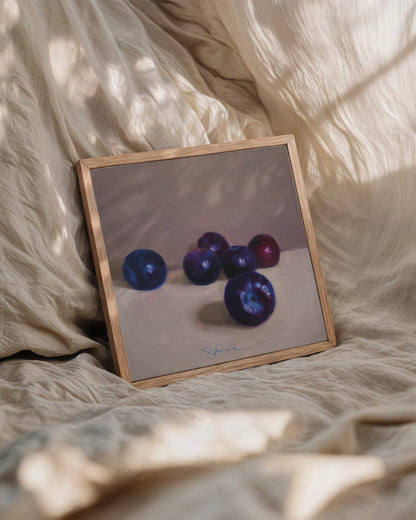 6 pretty plumbs sitting in a row